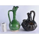 TWO LARGE AND UNUSUAL 19TH CENTURY CONTINENTAL POTTERY EWERS possibly Middle Eastern or Turkish.