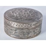 A Middle Eastern Silver Circular Box and Cover with Embossed Floral decoration. XRF Tested for