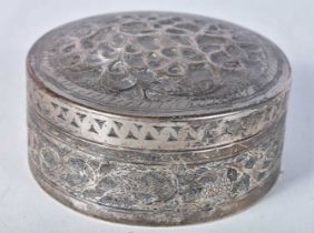 A Middle Eastern Silver Circular Box and Cover with Embossed Floral decoration. XRF Tested for