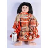A JAPANESE TAISHO PERIOD SILK EMBROIDERED FRIENDSHIP DOLL with glass eyes and human hair. 64 cm
