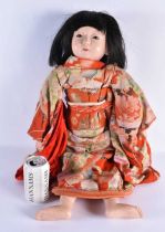 A JAPANESE TAISHO PERIOD SILK EMBROIDERED FRIENDSHIP DOLL with glass eyes and human hair. 64 cm