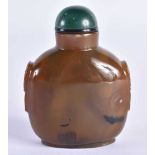A 19TH CENTURY CHINESE CARVED AGATE SNUFF BOTTLE Qing, with jade stopper. 7.5 cm x 5.5 cm.