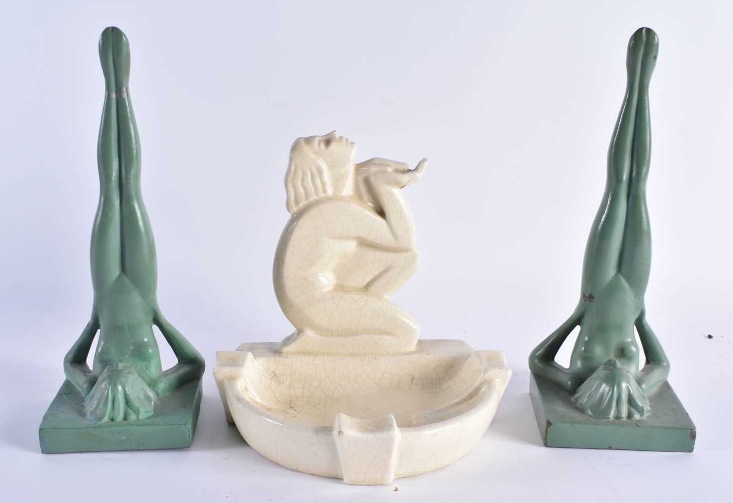 AN ART DECO FRENCH POTTERY FIGURAL ASHTRAY together with a pair of heavy painted art deco figural