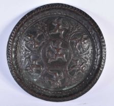 A 19TH CENTURY INDIAN BRONZE REPOUSSE DEITY DISH decorated with figures. 21 cm diameter.