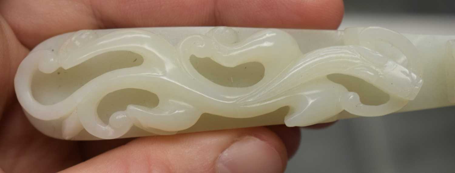A FINE PAIR OF CHINESE QING DYNASTY CARVED GREENISH WHITE JADE BELT HOOKS Qing, formed as stylised - Image 20 of 30