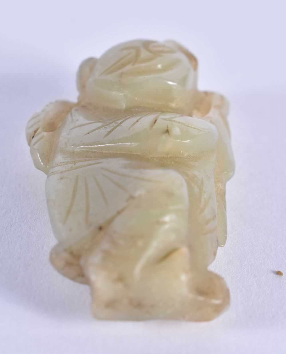 A SMALLER 19TH CENTURY CHINESE CARVED GREEN JADE FIGURE OF A BOY Qing. 4.5 cm x 2 cm. - Image 3 of 3