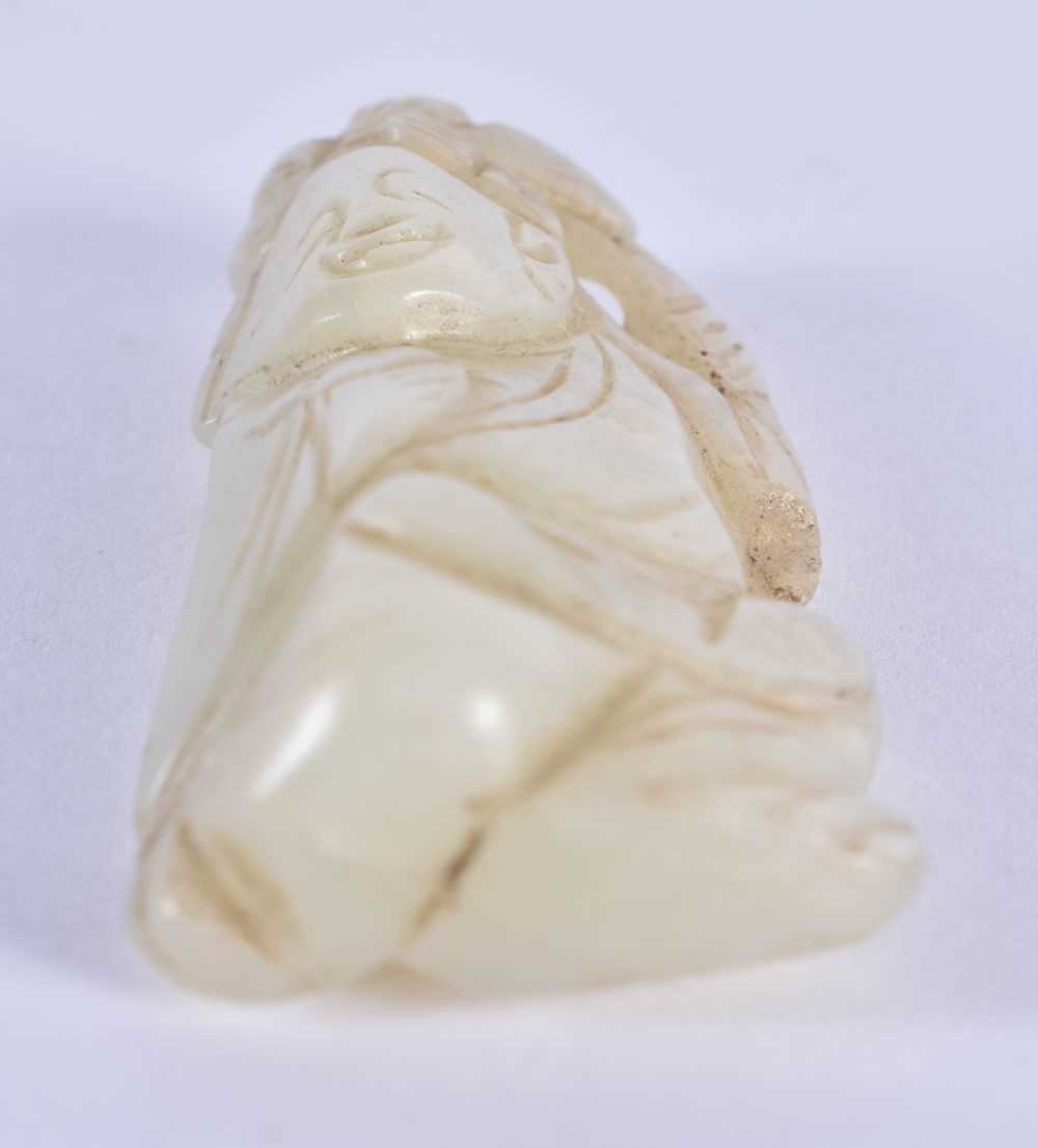 A 19TH CENTURY CHINESE GREENISH WHITE JADE FIGURE OF A YOUNG BOY Qing, modelled holding a flower. - Image 3 of 3