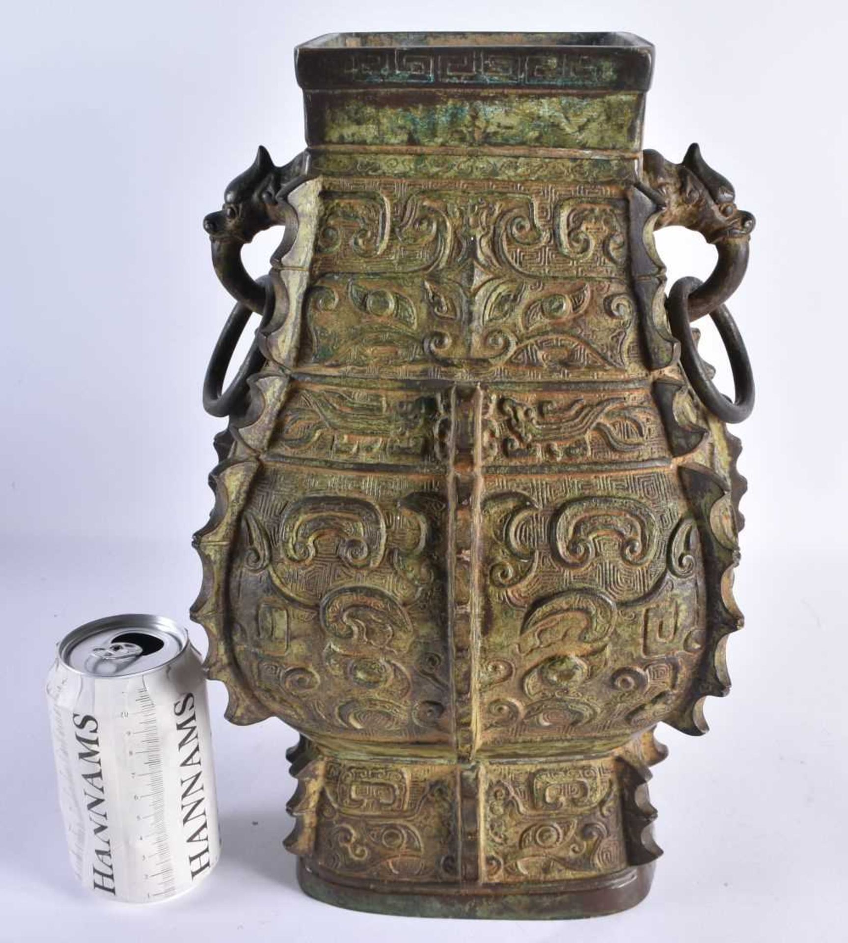 AN EARLY 20TH CENTURY CHINESE TWIN HANDLED BRONZE ARCHAIC VASE Late Qing/Republic, decorated with