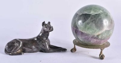 AN ANTIQUE ENGLISH SILVER PLATED RECUMBANT HOUND together with a hardstone ball on stand. Largest 12