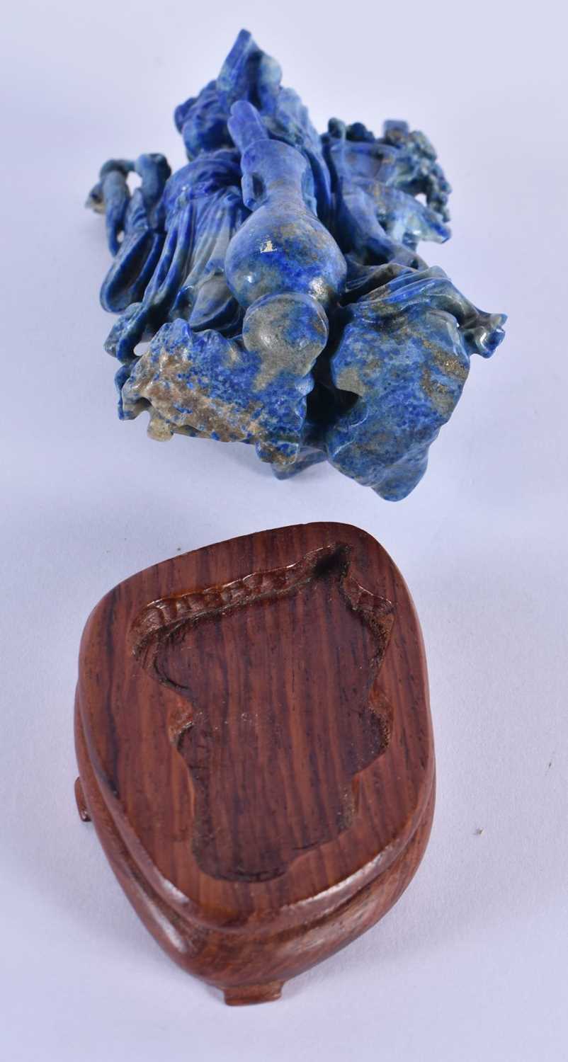 A LATE 19TH CENTURY CHINESE CARVED LAPIS LAZULI FIGURE OF A FEMALE Late Qing, modelled standing - Image 5 of 5