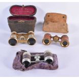 THREE PAIRS OF ANTIQUE ENAMELLED OPERA GLASSES. Largest 7 cm x 9 cm. (3)