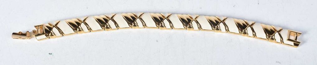 Gold tone and enamel bracelet by designer Nina Ricci . Stamped Ricci. Length 19.5cm, weight 55g