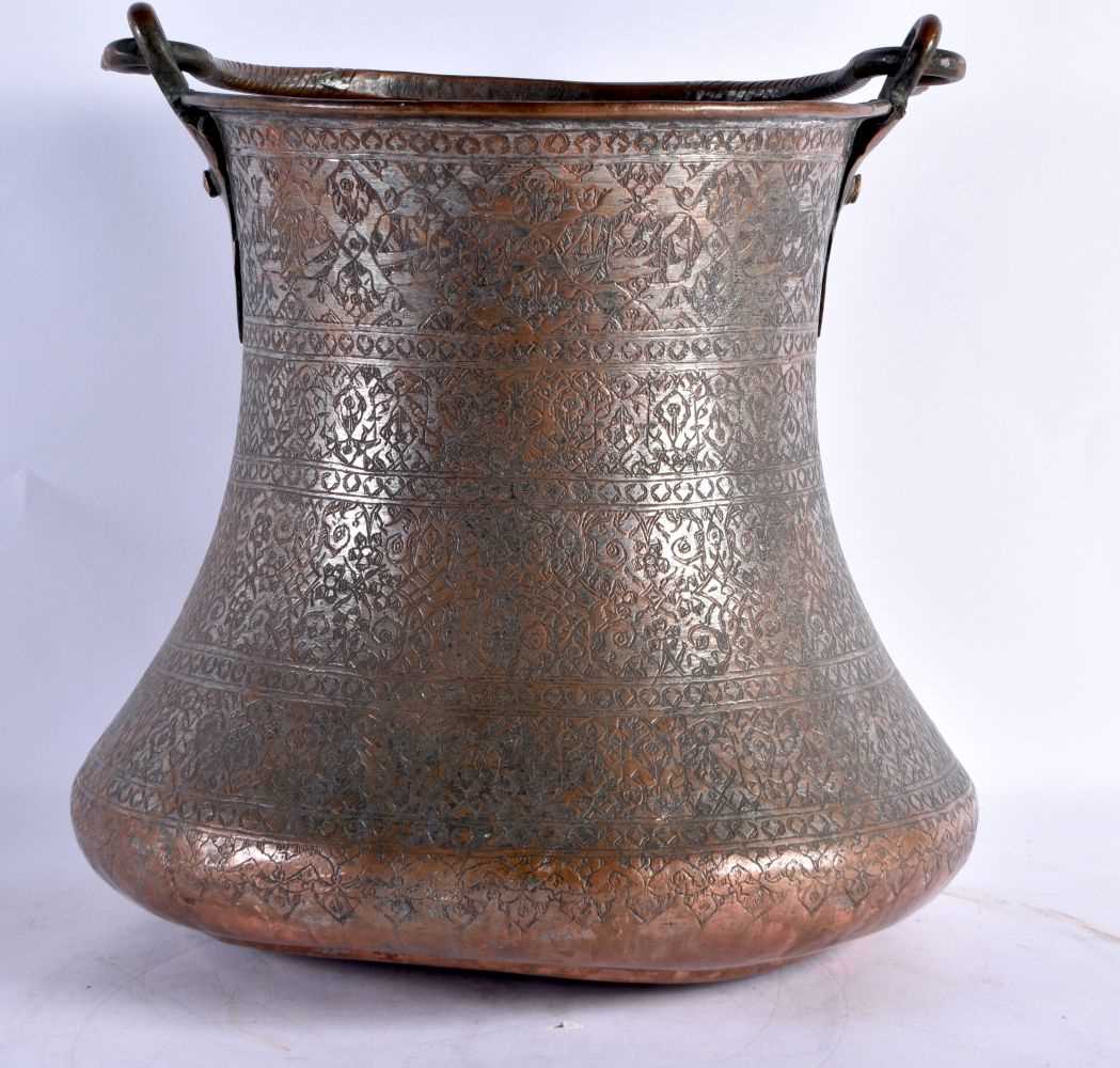 A very large find carved floral mortis, copper tinted Bucket, with a handle comprising of 2 Dragon