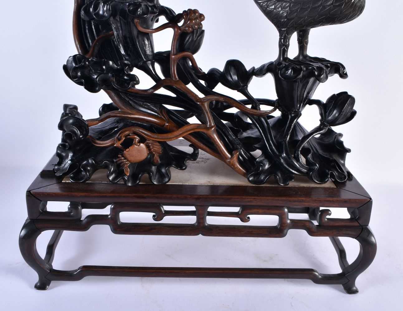 A RARE LARGE CHINESE QING DYNASTY BRONZE AND LACQUER STAND modelled as two birds, modelled upon a - Image 10 of 17