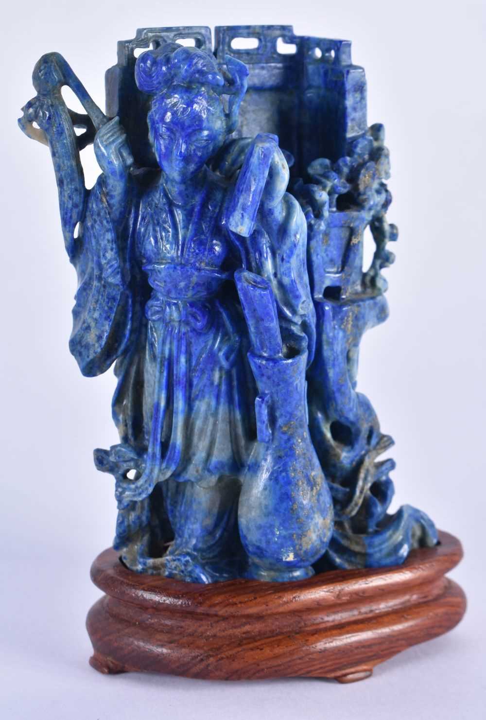 A LATE 19TH CENTURY CHINESE CARVED LAPIS LAZULI FIGURE OF A FEMALE Late Qing, modelled standing