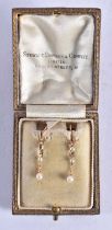 A PAIR OF VICTORIAN 15CT GOLD AND PEARL EARRINGS. 1.4 grams. 3 cm long.