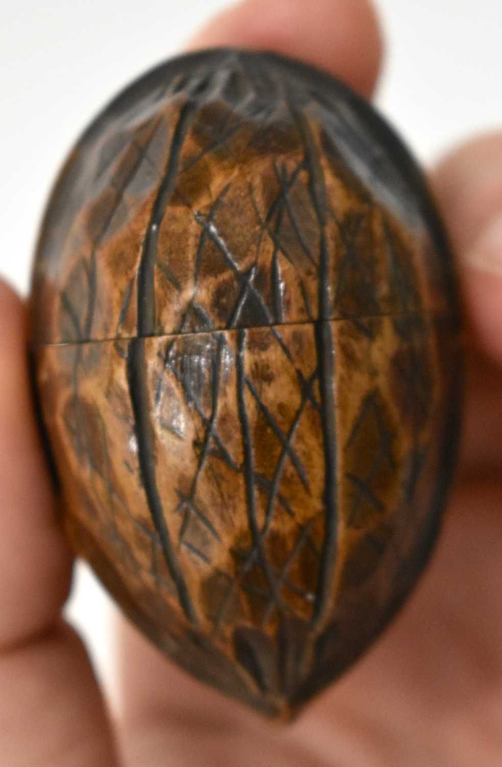 AN EXTREMELY RARE ANTIQUE CARVED NUT GLOBE the body rotating to reveal a tiny pocket globe. Nut 6 cm - Image 7 of 20