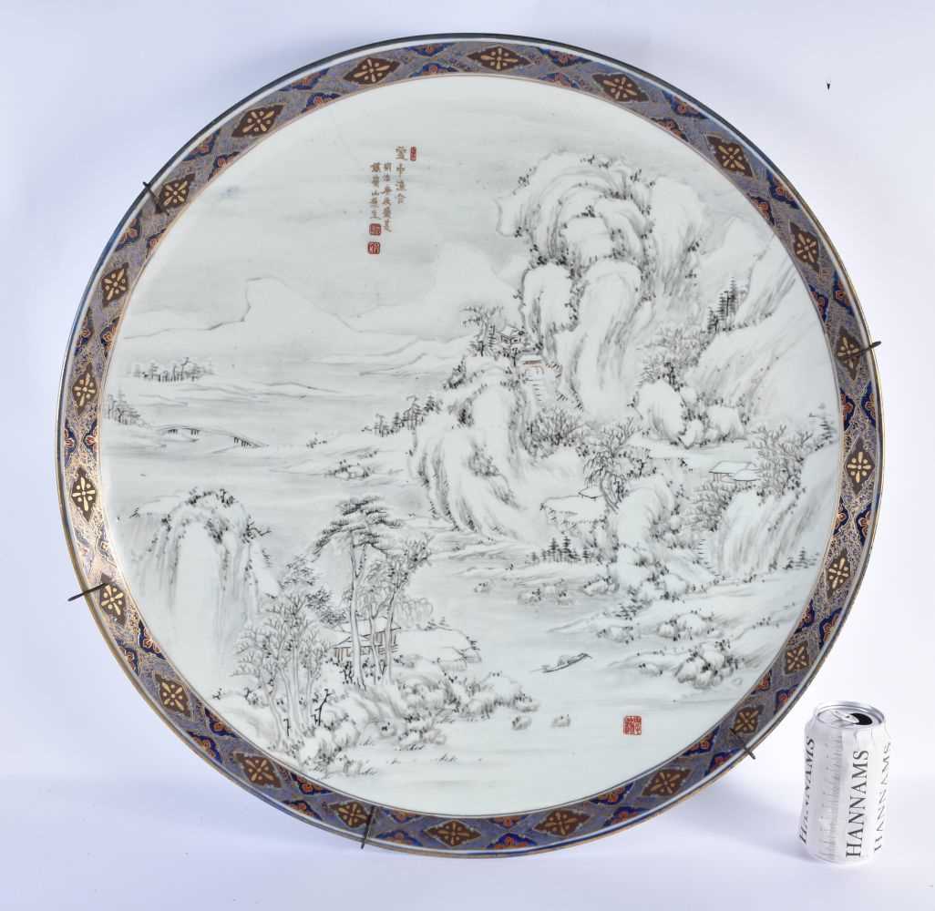 A VERY LARGE 19TH CENTURY JAPANESE MEIJI PERIOD PORCELAIN CHARGER of monumental proportions, painted