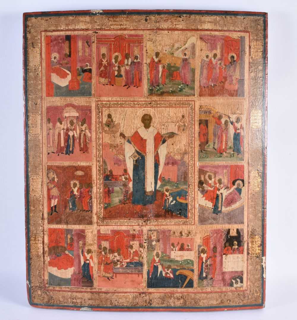 A LARGE 18TH CENTURY RUSSIAN PAINTED AND LACQUERED WOODEN ICON depicting saints in various