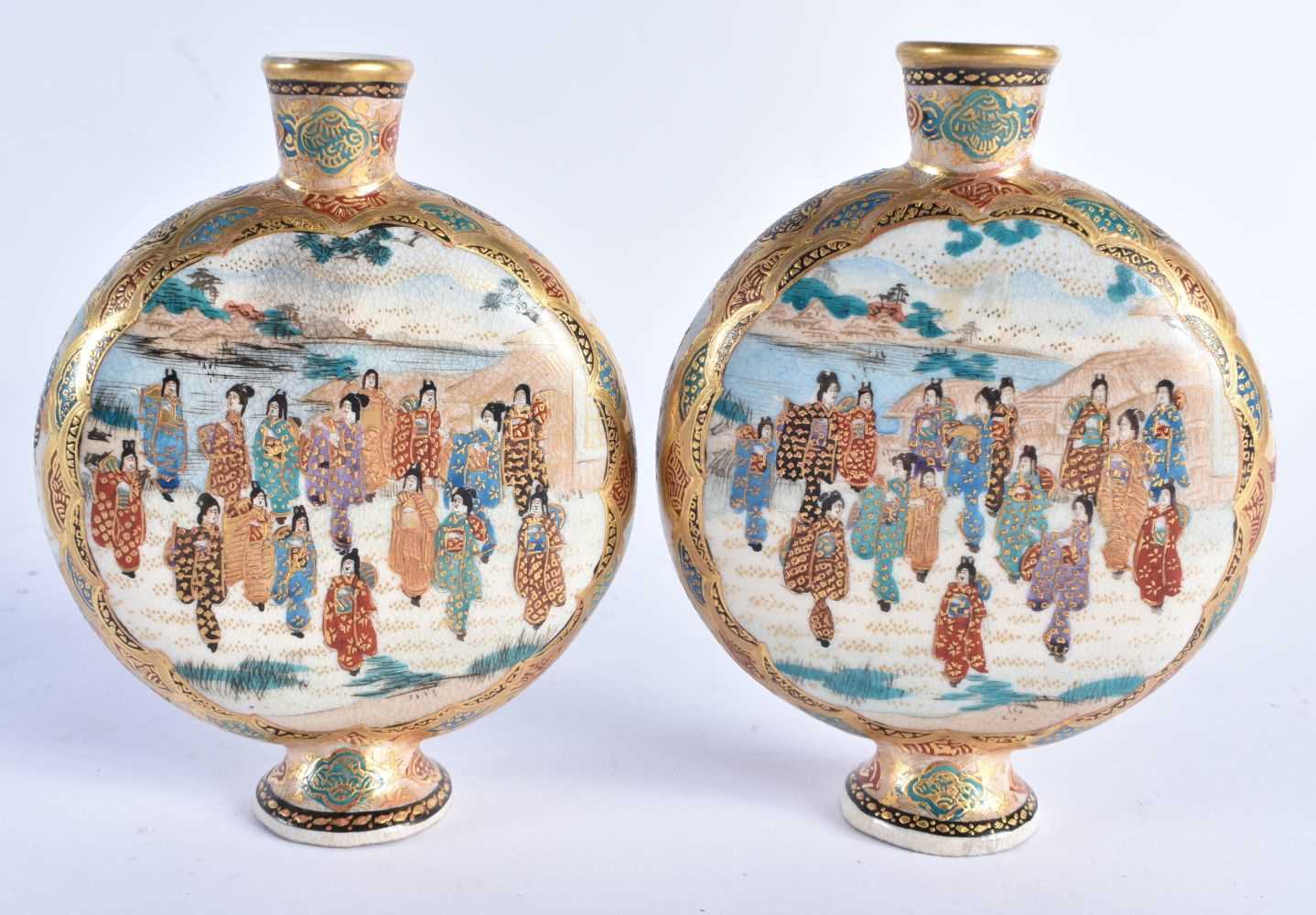 A PAIR OF 19TH CENTURY JAPANESE MEIJI PERIOD SATSUMA MOON FLASKS by Shimazu, painted with numerous