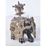 A Carved Wooden Elephant with Silver and Bone Decoration set with gems. Stamped 925, 10cm x 6.5cm