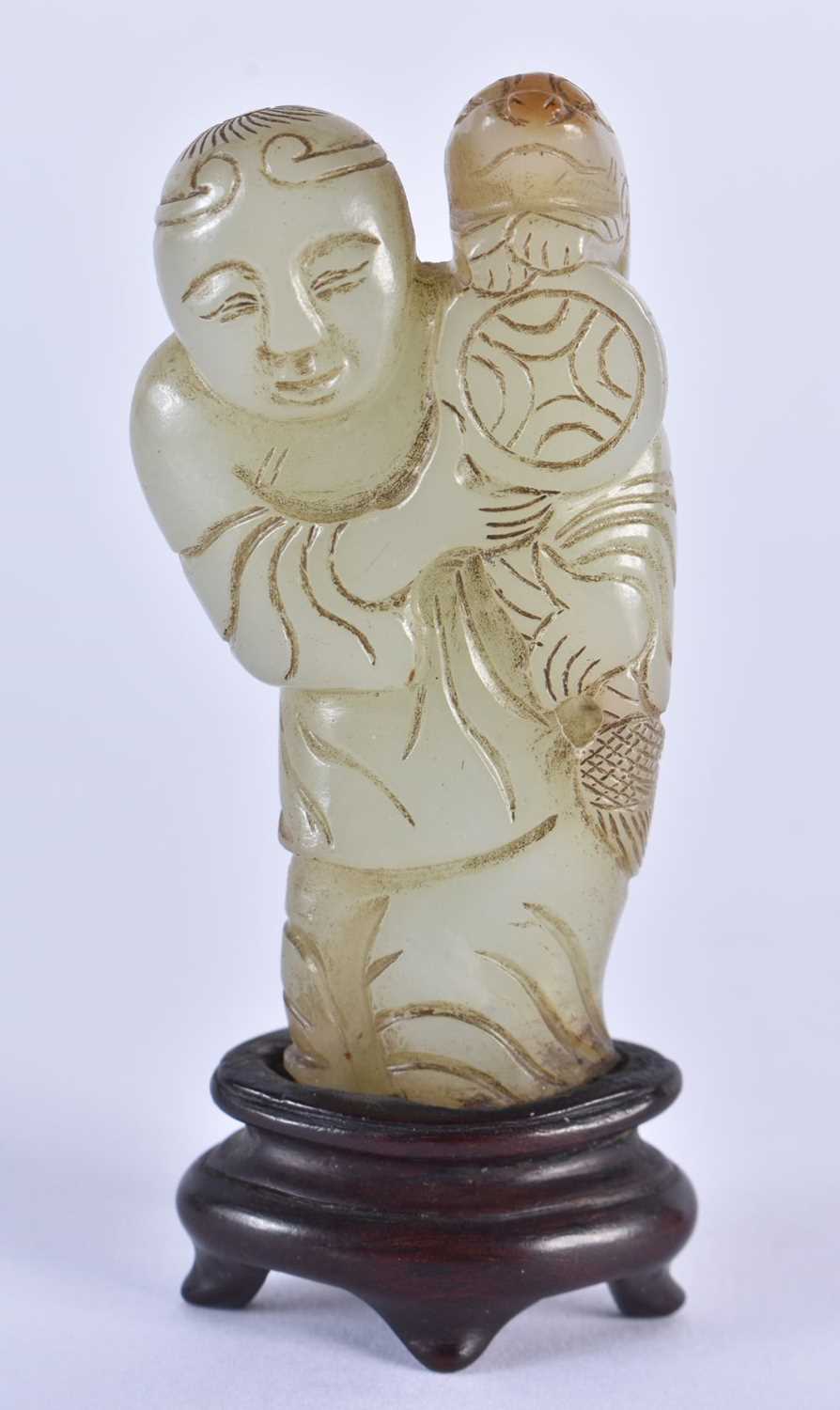 A LOVELY 19TH CENTURY CHINESE CARVED GREEN JADE FIGURE OF A STANDING MALE Qing, modelled holding a