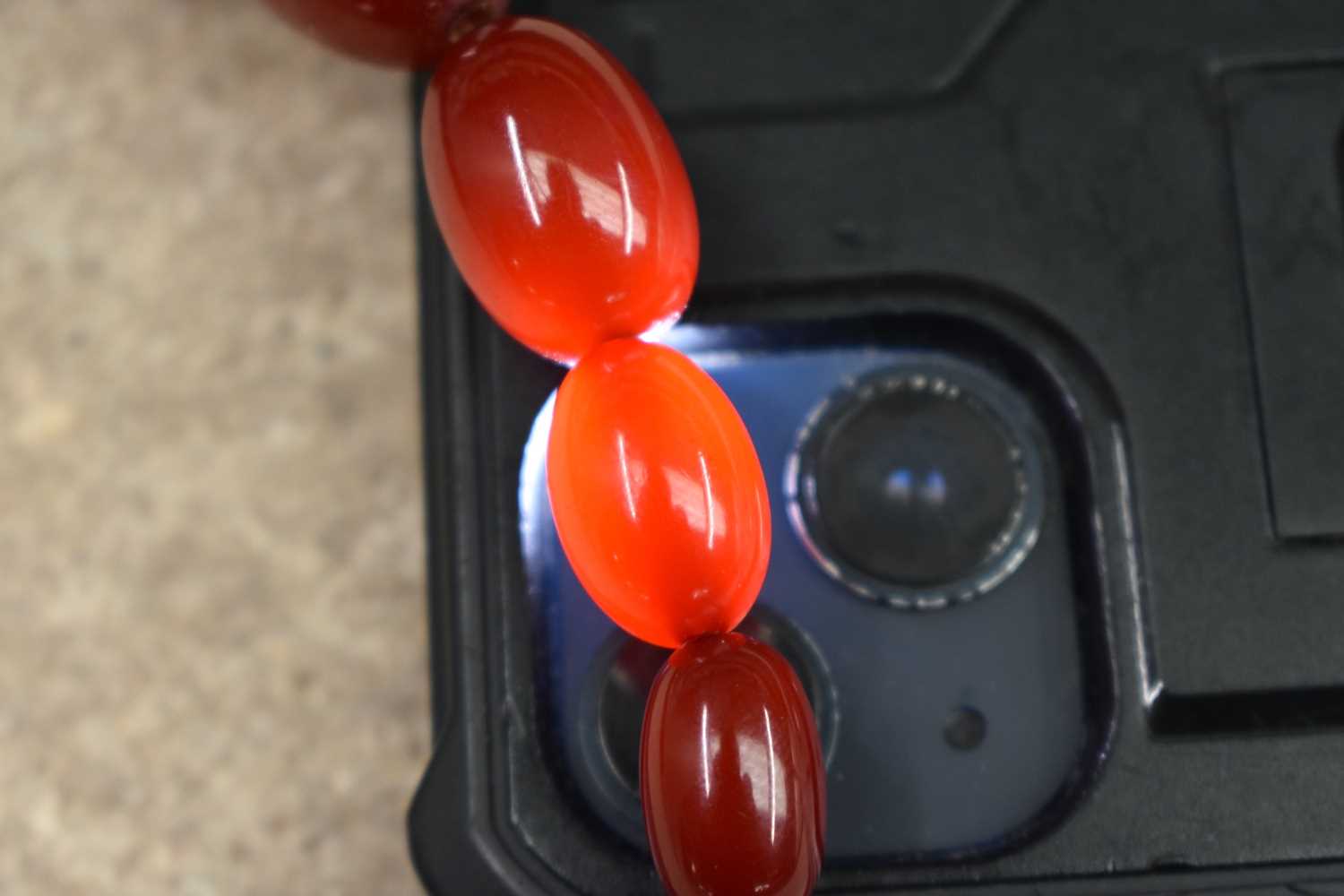 A CHERRY AMBER NECKLACE.69 grams. 84 cm long, largest bead 2.75 cm x 2.25 cm. - Image 6 of 6