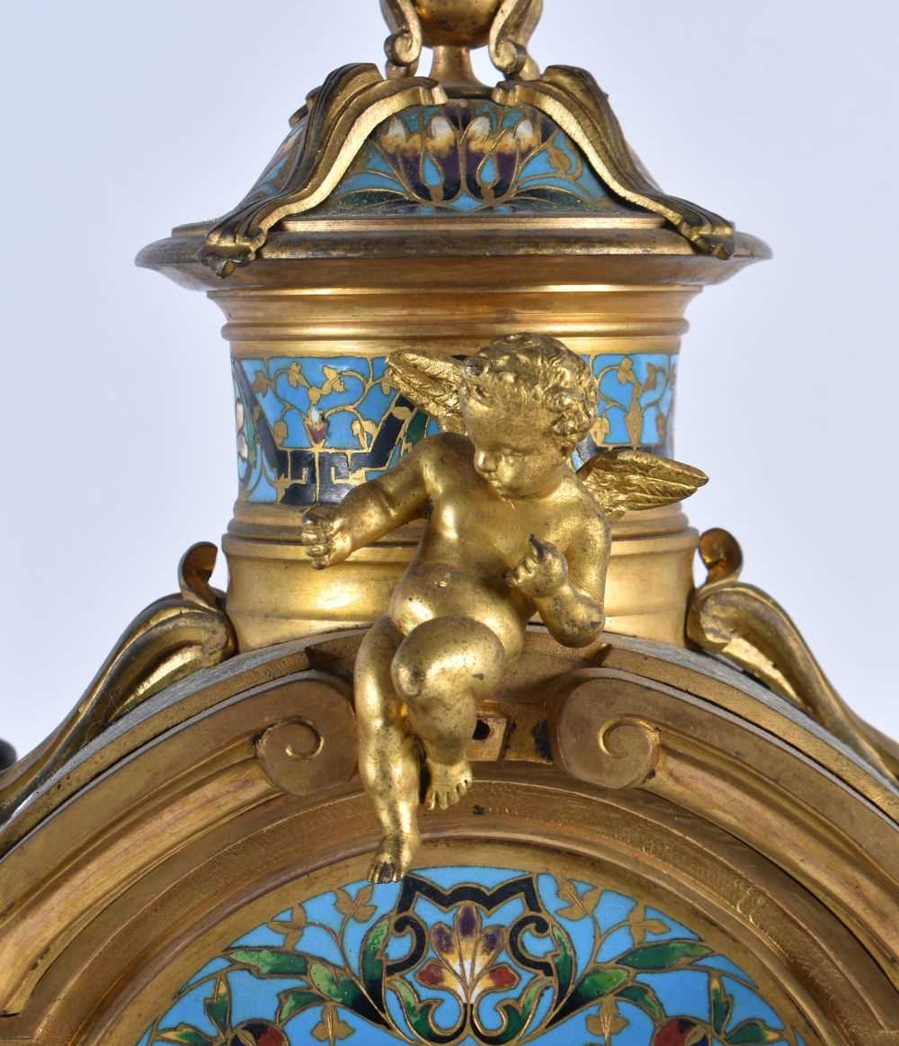 A FINE 19TH CENTURY FRENCH ORMOLU AND CHAMPLEVE ENAMEL CLOCK GARNITURE formed with putti amongst - Image 4 of 9