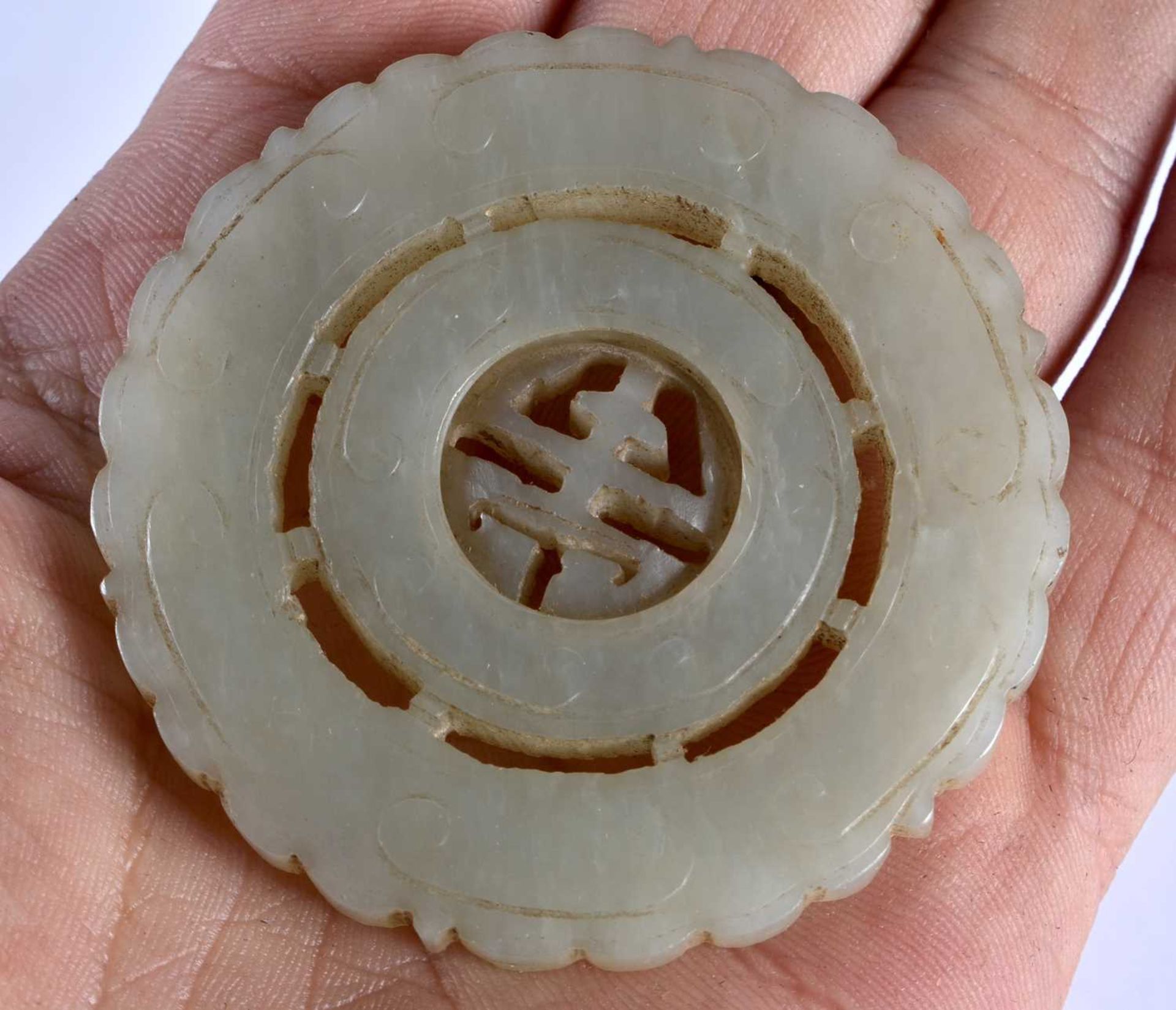 THREE 19TH CENTURY CHINESE GREEN JADE ROUNDELS Qing, in various forms. Jade 5 cm wide. (3) - Image 14 of 14