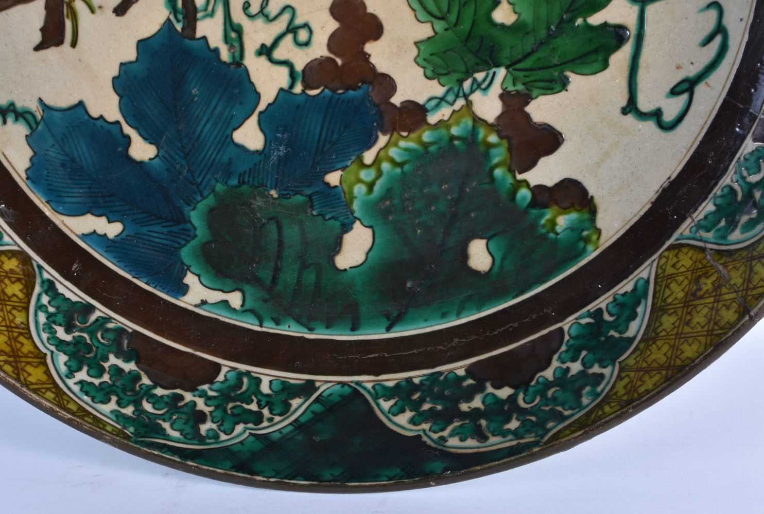 A LARGE 18TH CENTURY JAPANESE EDO PERIOD AO KUTANI DISH painted with flowers and landscapes. 37 cm - Image 3 of 6