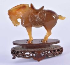 A 19TH CENTURY CHINESE CARVED AGATE FIGURE OF A HORSE Qing, modelled with head downturned. 7 cm x