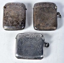 Three Engraved Silver Vesta Cases. Hallmarks include Birmingham 1921. Largest 5.3cm x 4cm x 1.2cm,