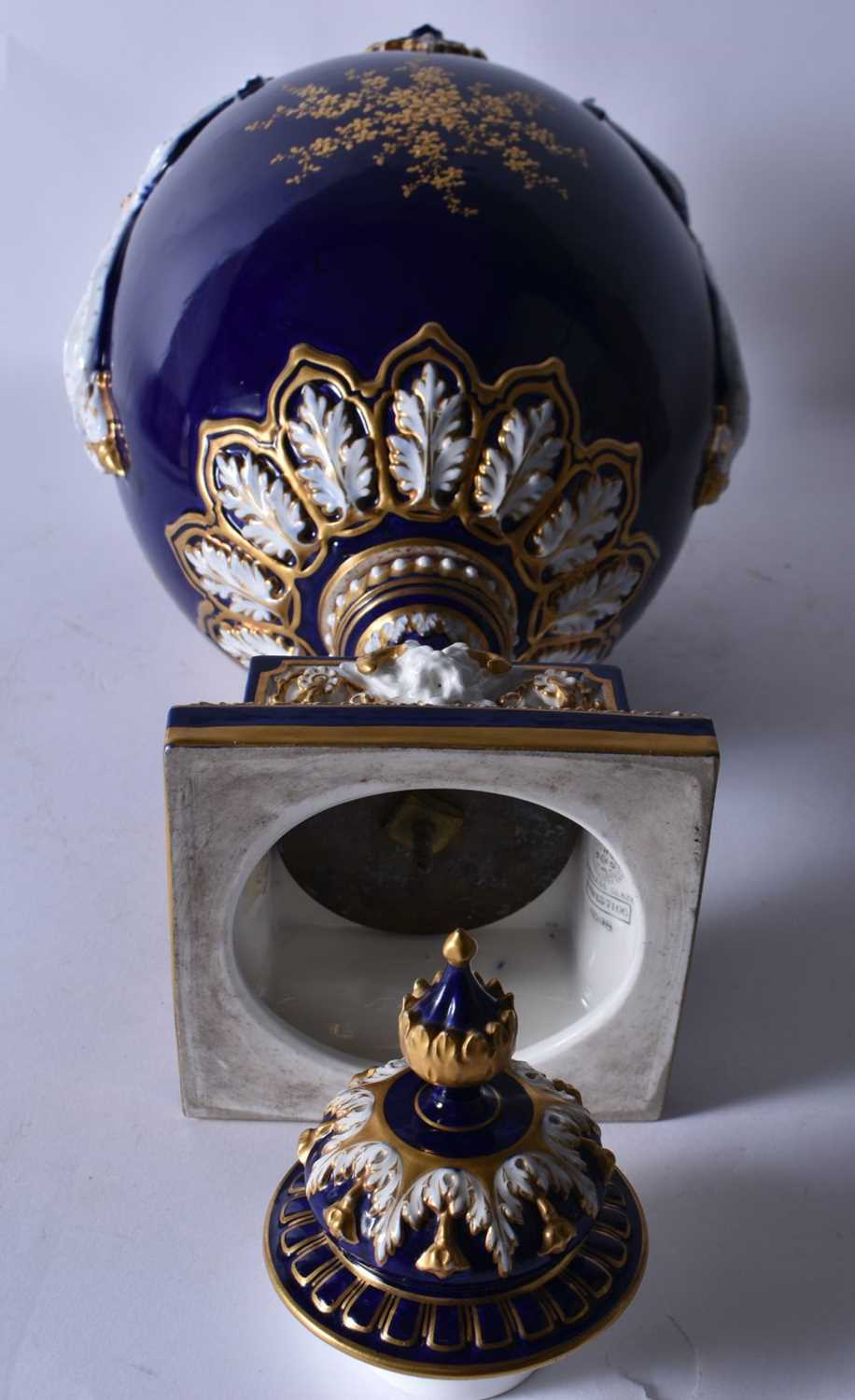 A FINE ROYAL WORCESTER TWIN HANDLED BLUE PORCELAIN VASE AND COVER painted with a landscape by - Image 8 of 9