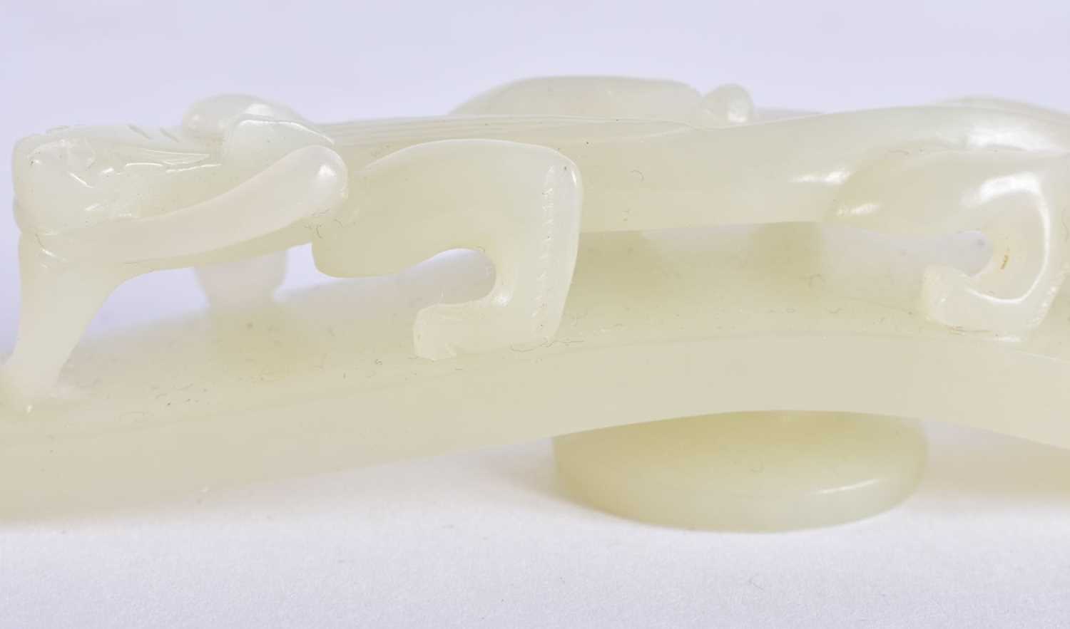 A FINE PAIR OF CHINESE QING DYNASTY CARVED GREENISH WHITE JADE BELT HOOKS Qing, formed as stylised - Image 7 of 30