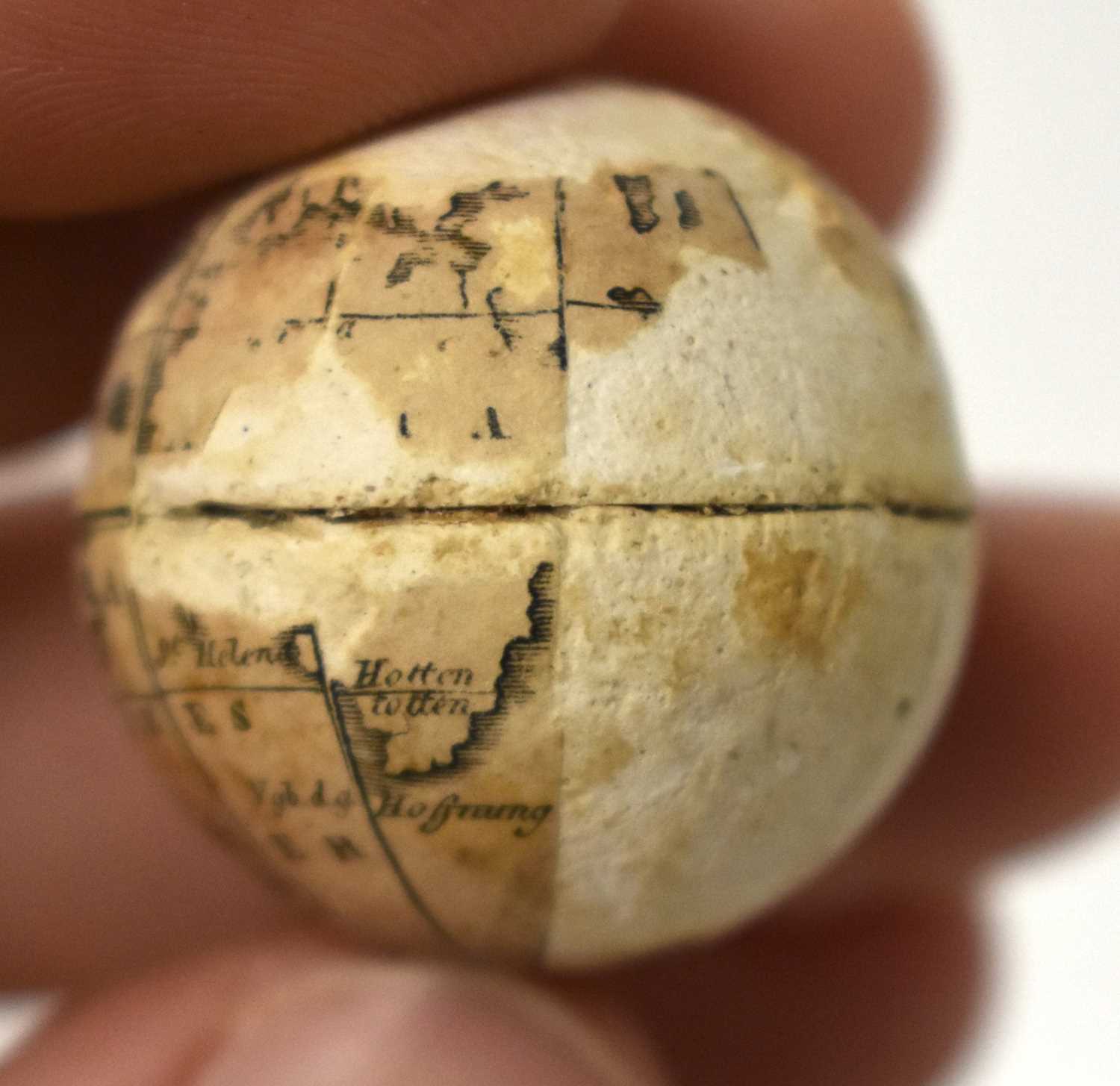AN EXTREMELY RARE ANTIQUE CARVED NUT GLOBE the body rotating to reveal a tiny pocket globe. Nut 6 cm - Image 17 of 20