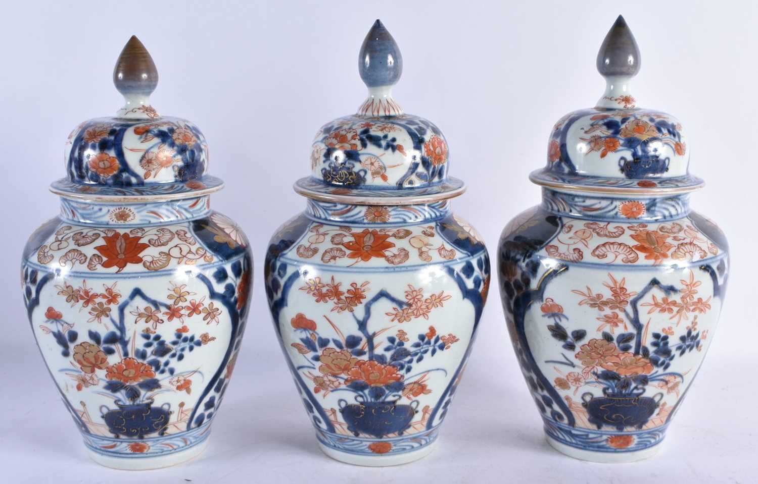 AN 18TH CENTURY JAPANESE EDO PERIOD IMARI PORCELAIN GARNITURE OF VASES painted with flowers. Largest - Image 2 of 8