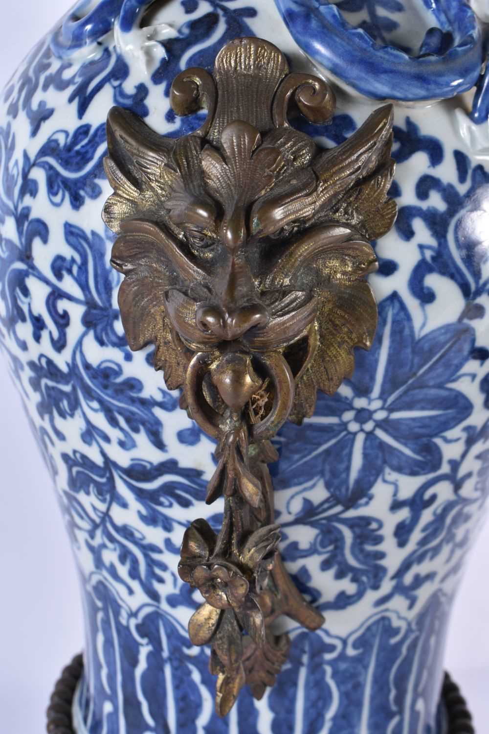 A LARGE PAIR OF 19TH CENTURY CHINESE BLUE AND WHITE BRONZE MOUNTED VASES Qing. 48 cm high. - Image 6 of 24