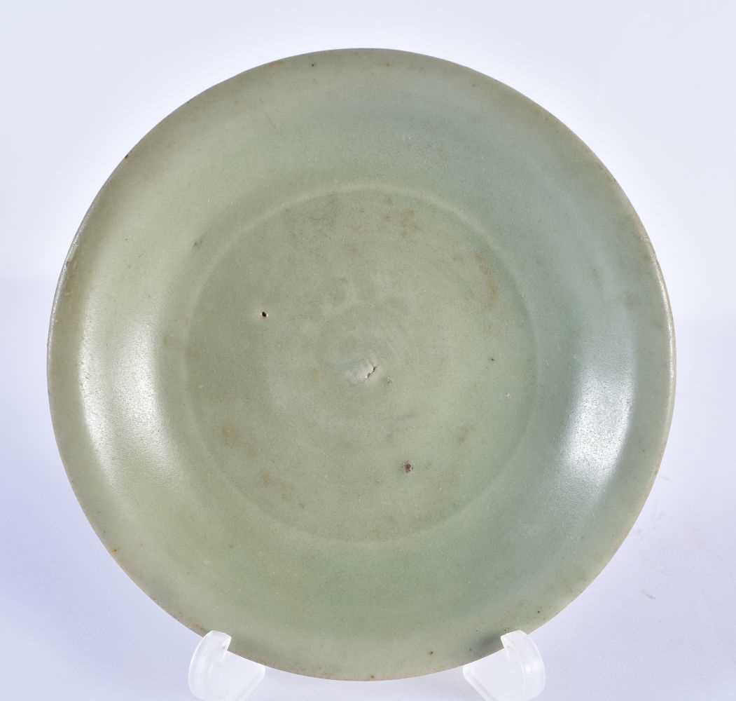 A CHINESE MING DYNASTY CELADON CIRCULAR DISH together with a Qing dynasty guan type bowl. Largest 14 - Image 2 of 7