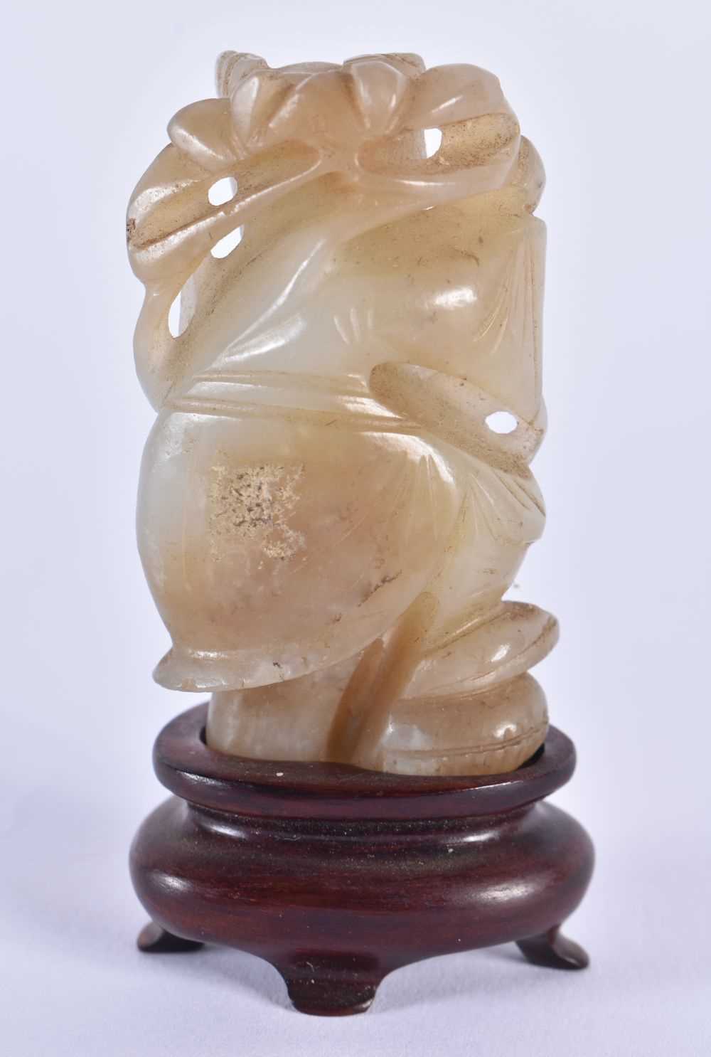 A 19TH CENTURY CHINESE CARVED JADE FIGURE OF A YOUNG CHILD Qing, modelled holding foliage. 7.5 cm - Image 5 of 7