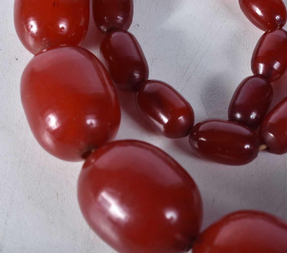 Cherry Bakelite graduated necklace with internal streaking. 99cm long, largest bead 30mm (165g) - Image 2 of 7