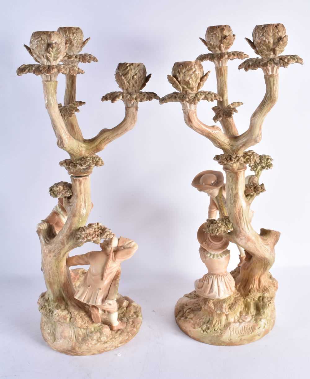 A RARE PAIR OF ROYAL WORCESTER HADLEYS BLUSH IVORY FIGURAL CANDLESTICKS modelled as children upon - Image 5 of 8