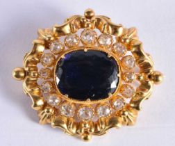 A FINE VICTORIAN HIGH CARAT GOLD AND OLD CUT DIAMOND BROOCH inset with a large blue stone (