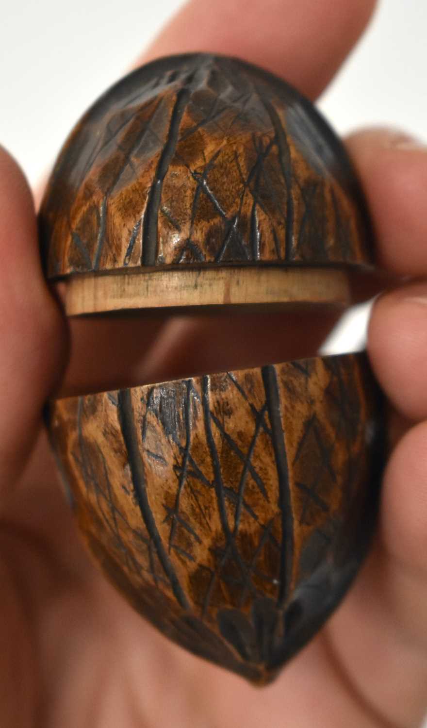 AN EXTREMELY RARE ANTIQUE CARVED NUT GLOBE the body rotating to reveal a tiny pocket globe. Nut 6 cm - Image 12 of 20