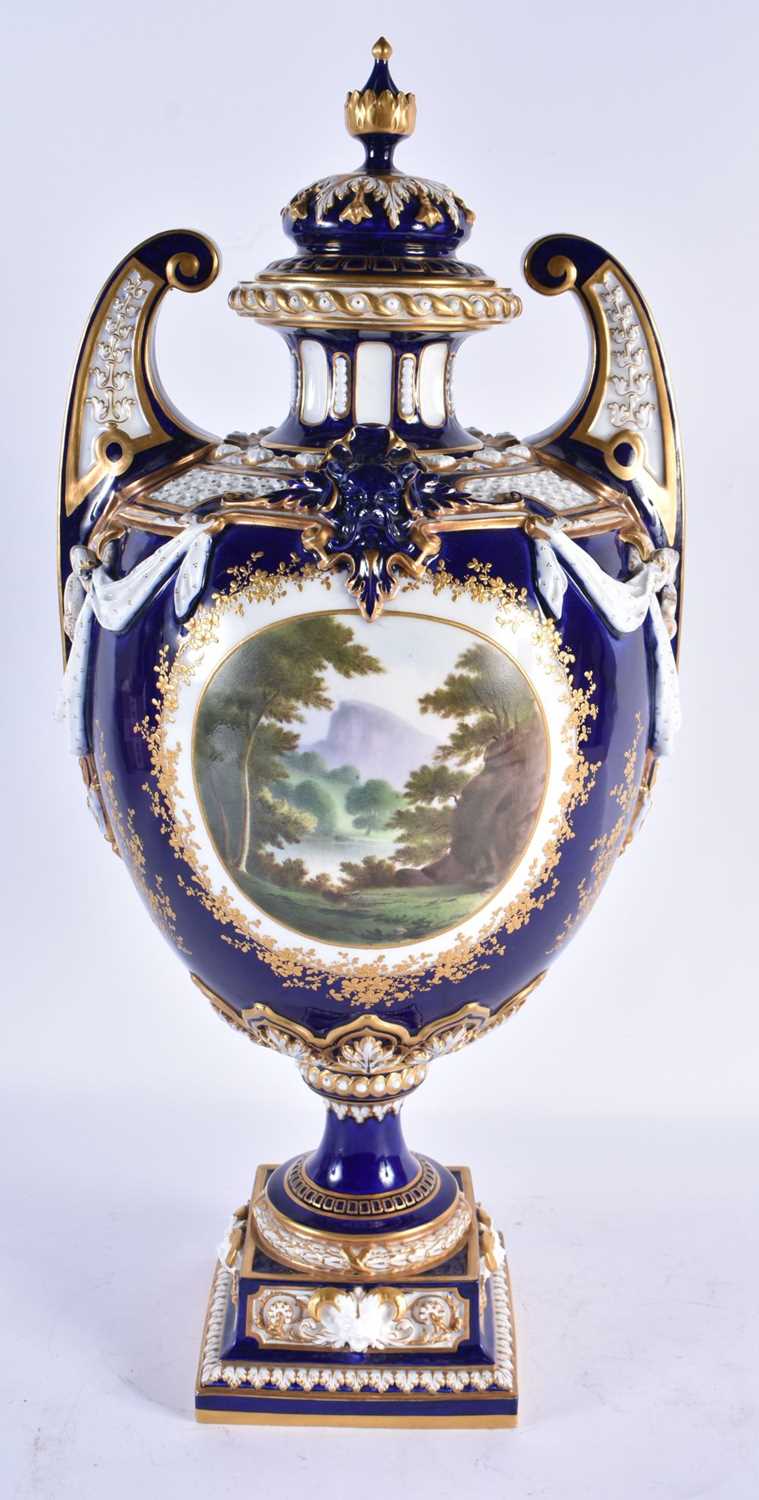 A FINE ROYAL WORCESTER TWIN HANDLED BLUE PORCELAIN VASE AND COVER painted with a landscape by - Image 2 of 9