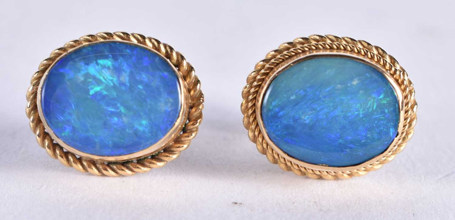 A Pair of 9 Ct Gold Earrings set with an Opal. Weight 2.63g