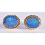 A Pair of 9 Ct Gold Earrings set with an Opal. Weight 2.63g