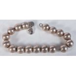 Silver beaded bracelet by designer Tiffany & Co. Stamped Tiffany 925. 18cm long, weight 18g, Bead