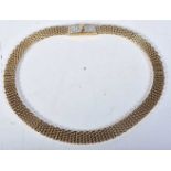 Gold tone collar necklace with stone set clasp by designer Nina Ricci. Stamped Nina Ricci, length