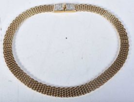 Gold tone collar necklace with stone set clasp by designer Nina Ricci. Stamped Nina Ricci, length