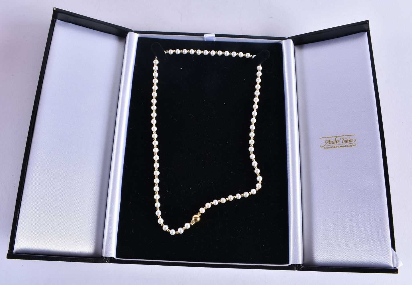 AN 18CT GOLD AND PEARL NECKLACE. 10.8 grams. 46 cm long.